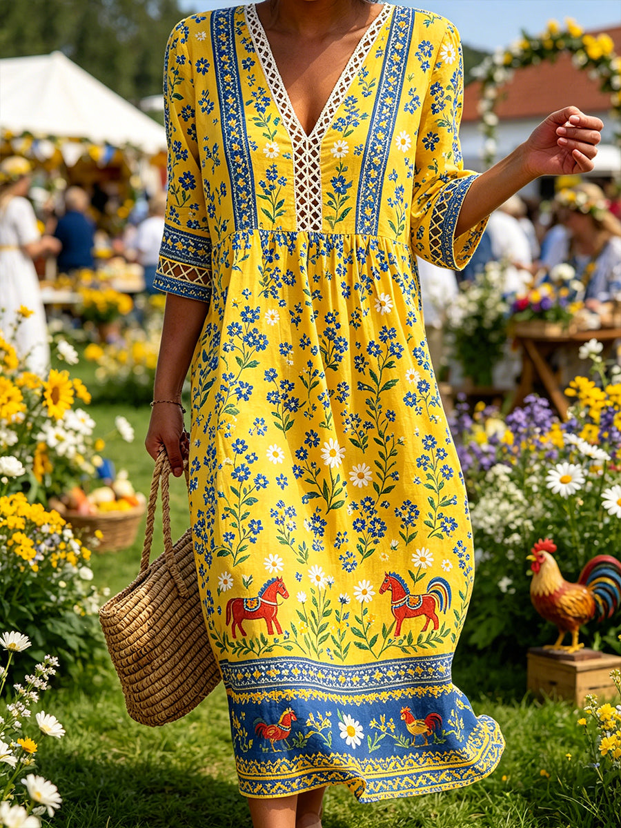 Damskjorta i midsommarstil med V-ringning och etniskt mönster
