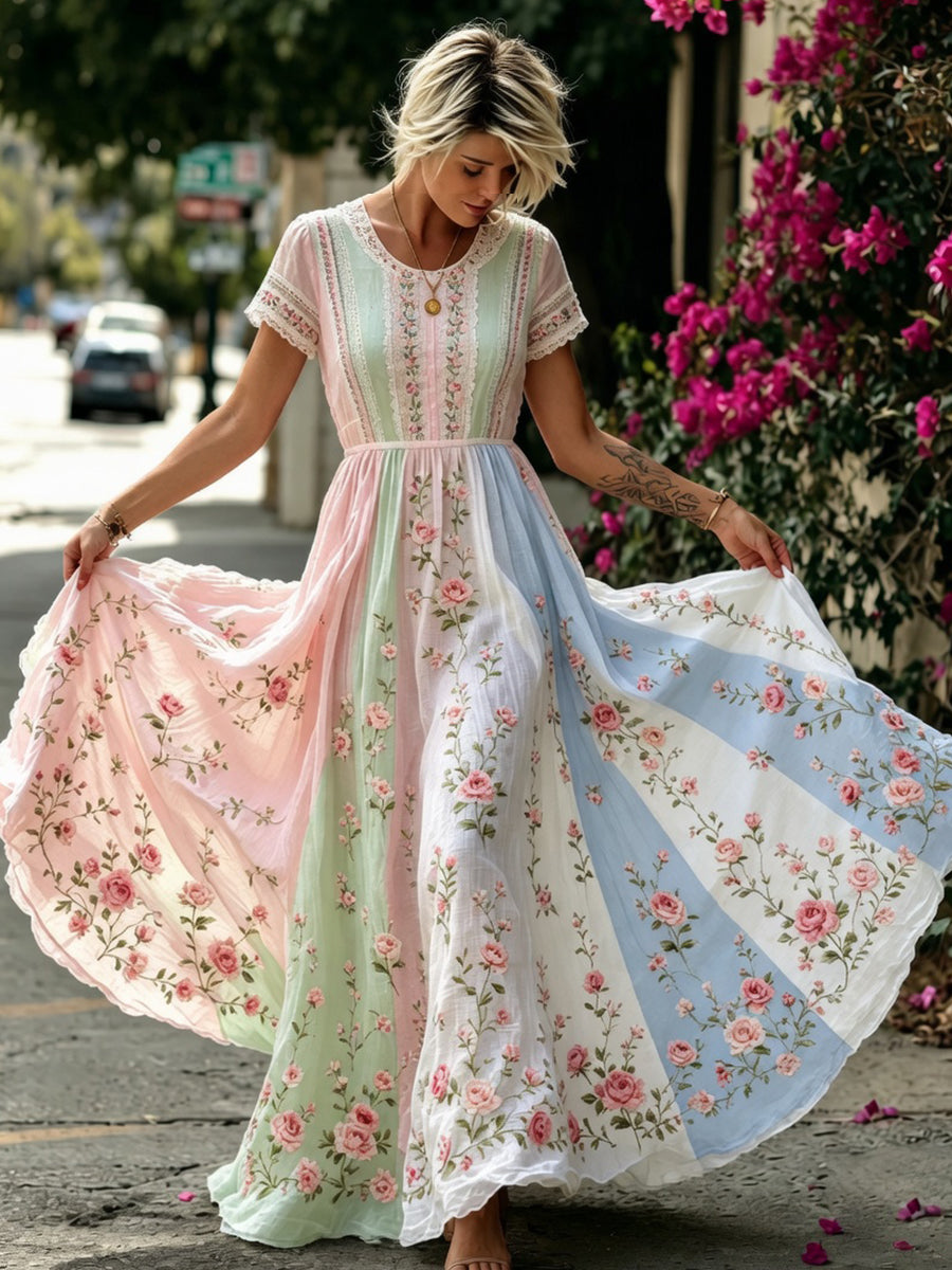 Damskjorta i bohemisk stil med blommig brodyr, rund halsringning och korta ärmar, midi-längd