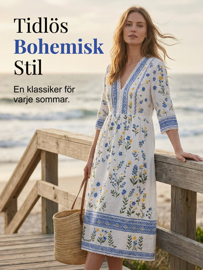 Damskjorta i midsommarstil med V-ringning och etniskt mönster