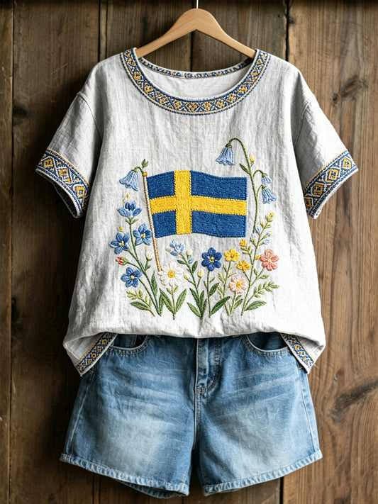 Damenes økte genser med svensk tekst om planter og blomster, avslappet stil
