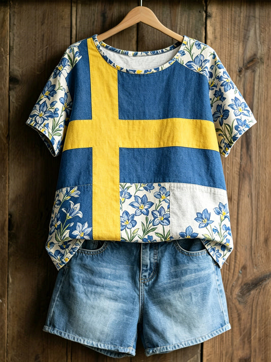 Damenes økte genser med svensk tekst om planter og blomster, avslappet stil