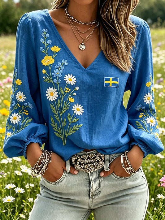 Dame-midtsommertopp i linimitasjon med blomstermønster og lange ermer