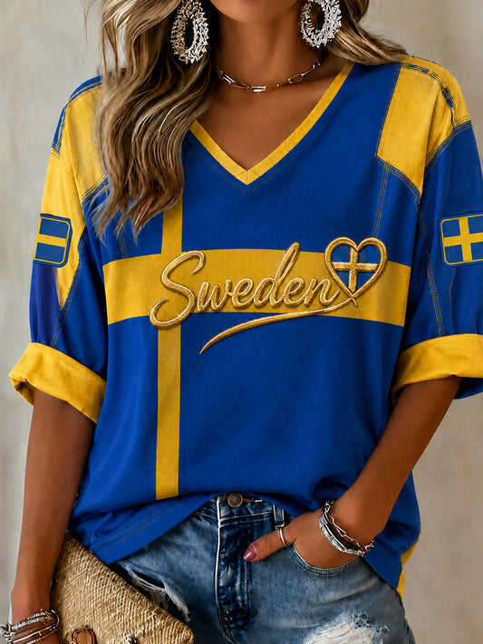 Dammens retrovikinginspirerte hverdagsgenser med merke med det svenske fotballagets flagg