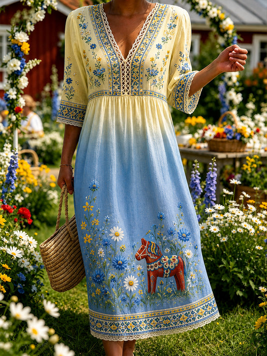 Dammens midtsommerkjole med blomstermønster og v-hals