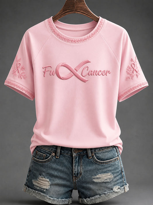 Kvinnlig avslappnad t-shirt med budskapet ”Fuck Cancer” för bröstcancerförebyggande och medvetandegöring