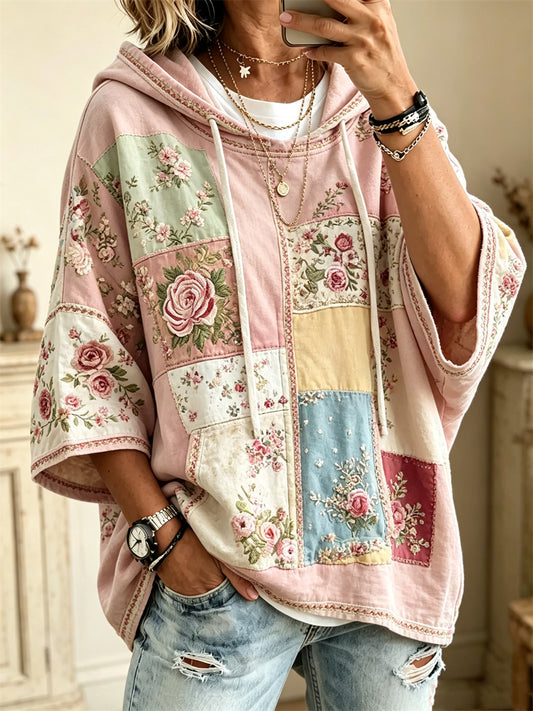 Damvintertröja i vintagestil med rosa rosor och blommönstrad färgblockdesign, halvlånga ärmar och oversize-huva